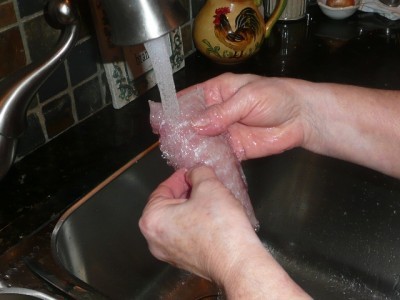 ... washing a piece of fillet for the fried burbot recipe!